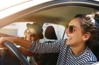 two people riding in a car