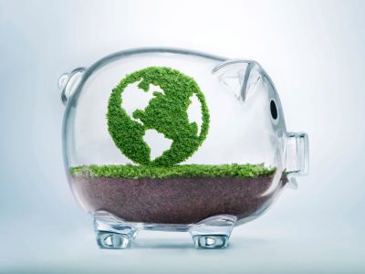 Green Earth inside a glass piggybank